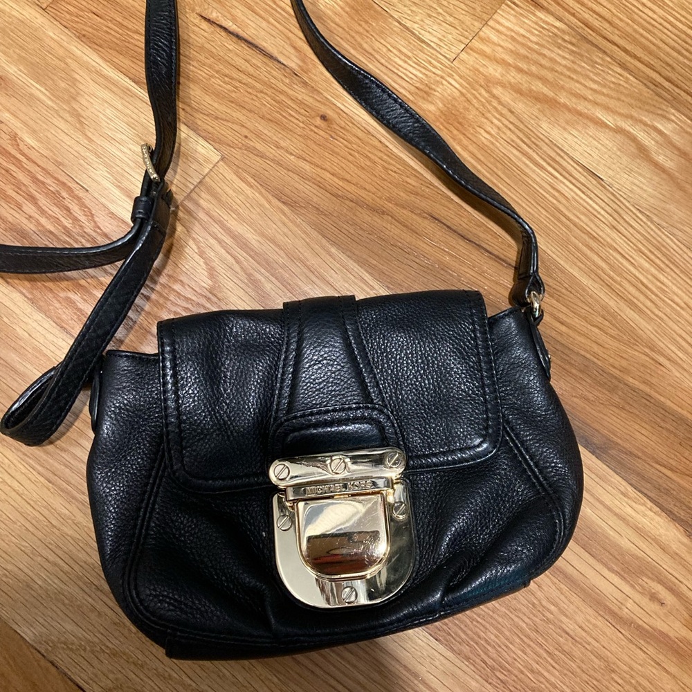 Black Michael Kors cross body purse with gold latch